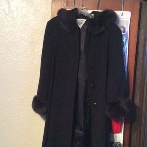 Full length black winter coat with faux fur cuffs
